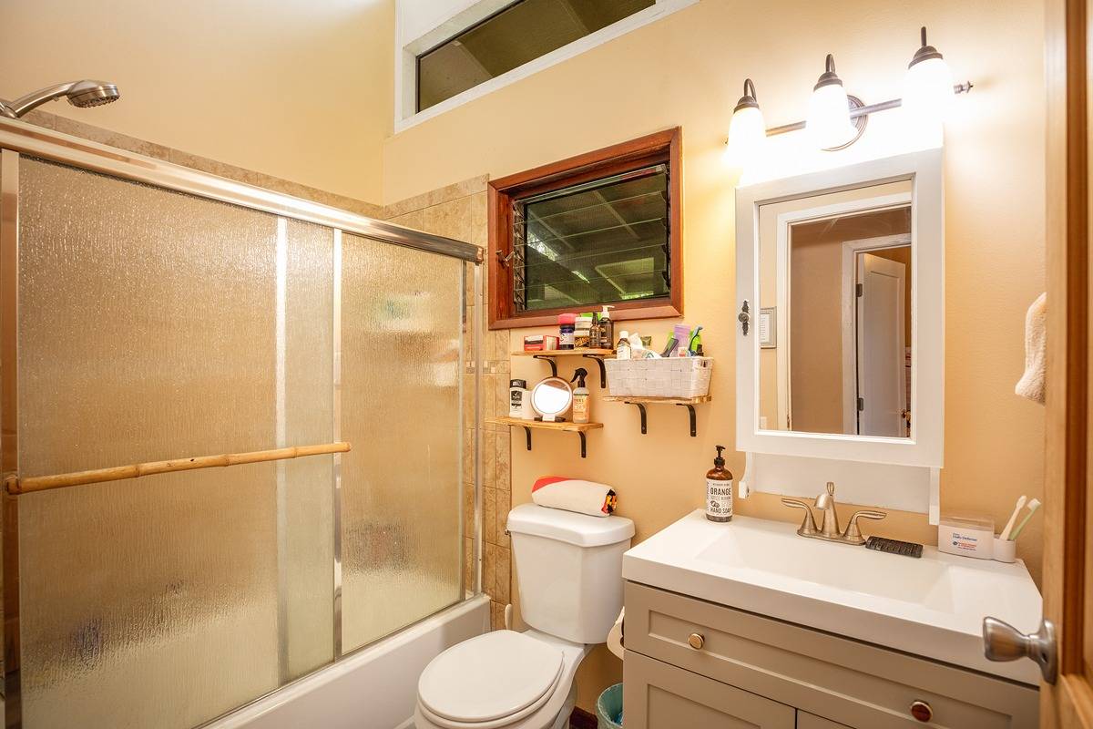 2060 Puukaa Street Kapaa, HI 96746 - Photo 9 of 19 a bathroom with a sink a toilet and shower