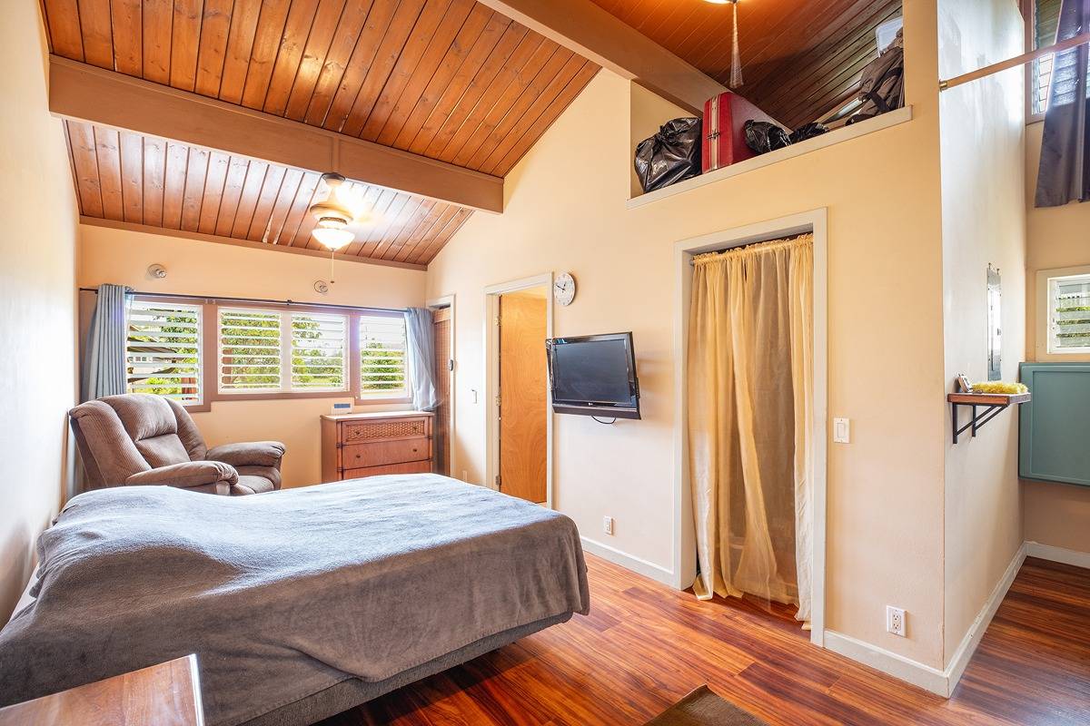 2060 Puukaa Street Kapaa, HI 96746 - Photo 10 of 19 a bedroom with bed and wooden floor
