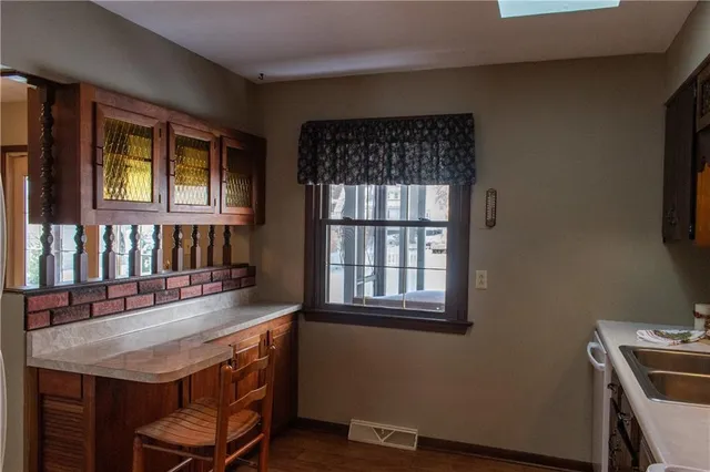 a kitchen with a sink and cabinets