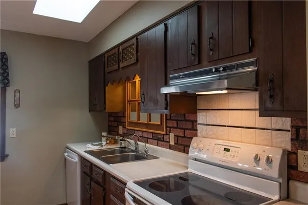 a kitchen with a sink and cabinets