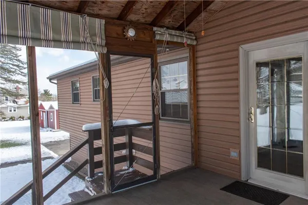 a view of a porch with a door