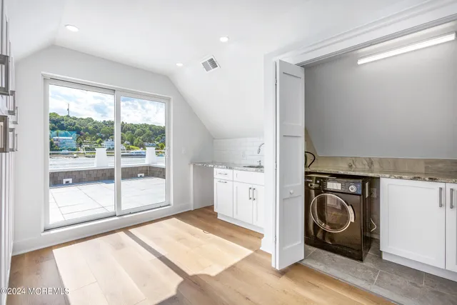 a view of a storage & utility room with a washer dryer
