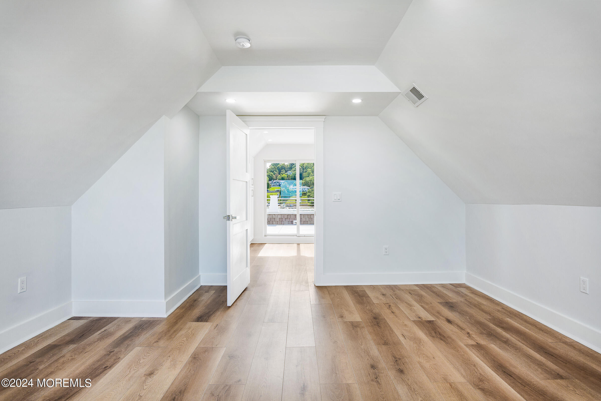 10 Via Ripa Way, Unit 2 Sea Bright, NJ 07760 - Photo 32 of 44 a view of empty room with wooden floor and fan