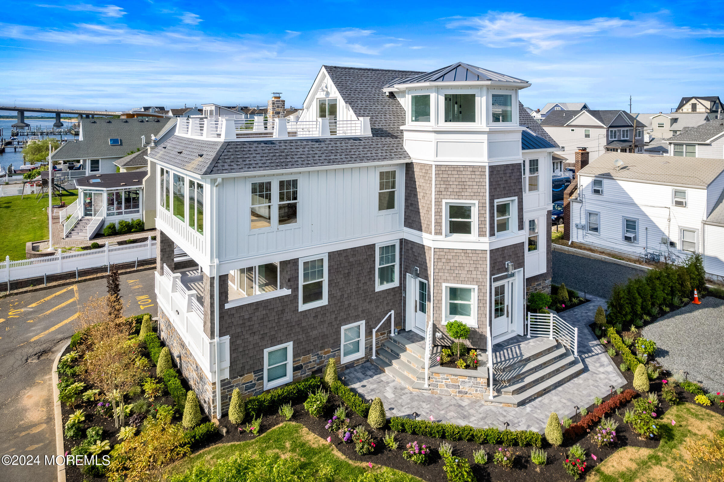 10 Via Ripa Way, Unit 2 Sea Bright, NJ 07760 - Photo 36 of 44 a front view of a building with a garden