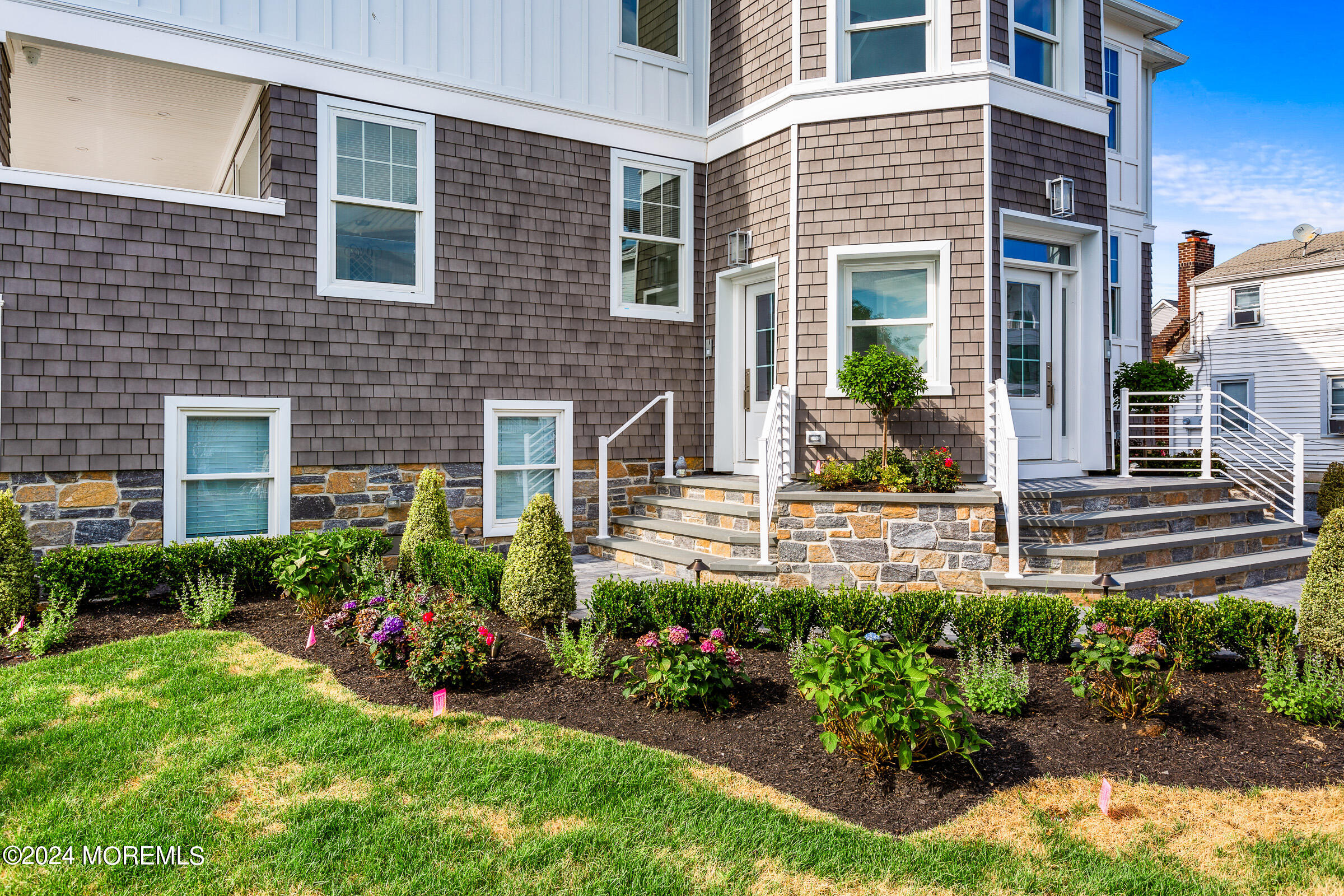 10 Via Ripa Way, Unit 2 Sea Bright, NJ 07760 - Photo 41 of 44 a view of a house with brick walls and garden
