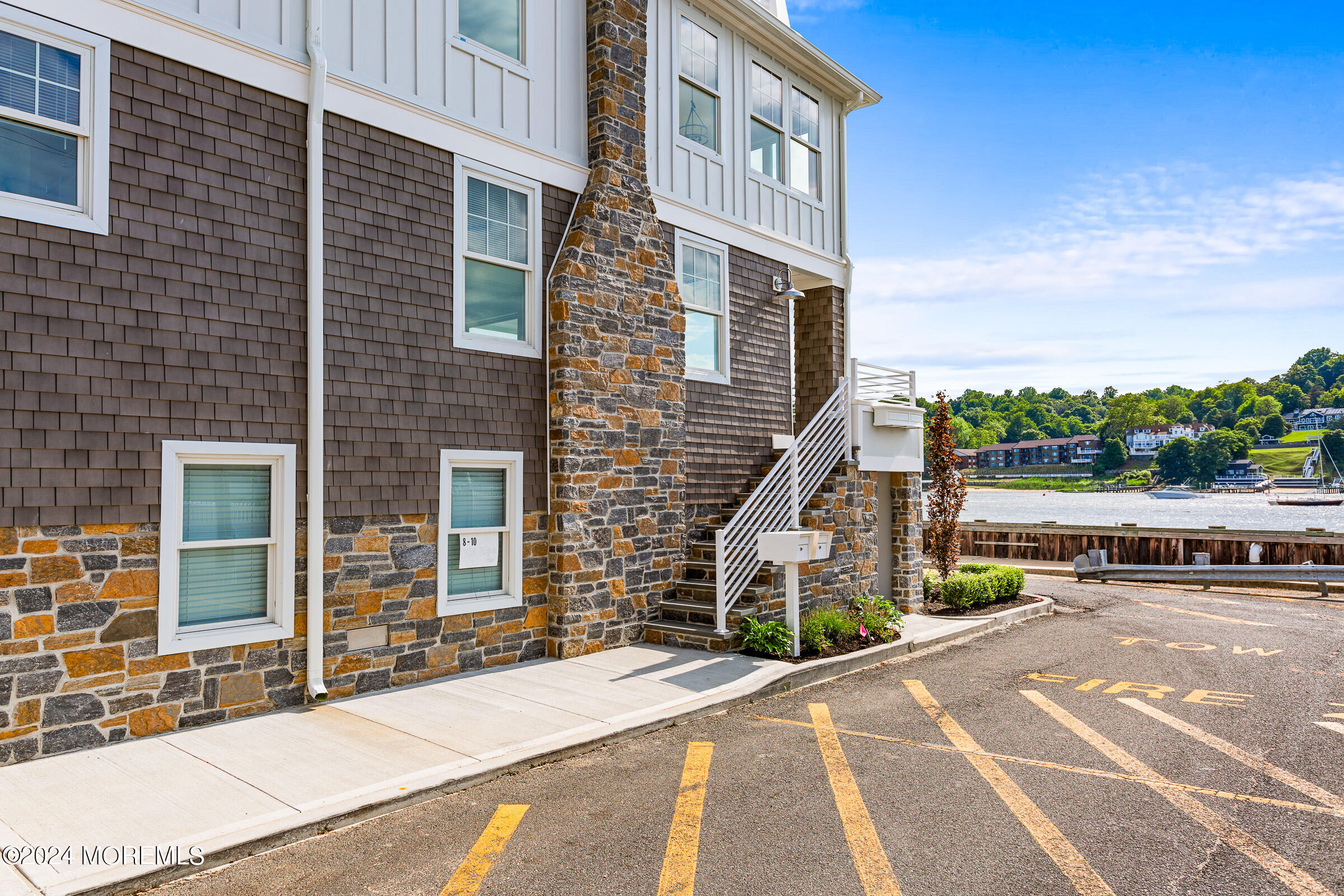 10 Via Ripa Way, Unit 2 Sea Bright, NJ 07760 - Photo 44 of 44 a view of a brick building next to a yard