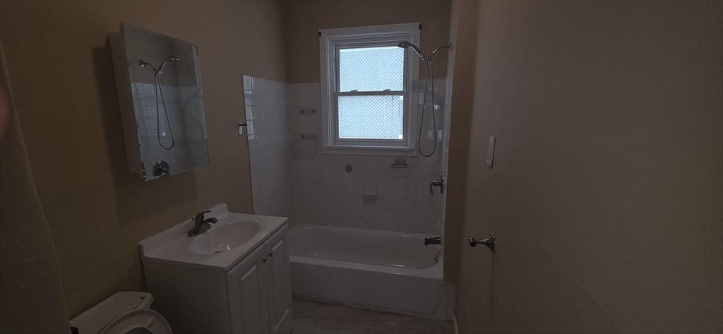105 6th Street, Unit 3 Fall River, MA 02721 - Photo 2 of 10 a bathroom with a sink toilet and shower