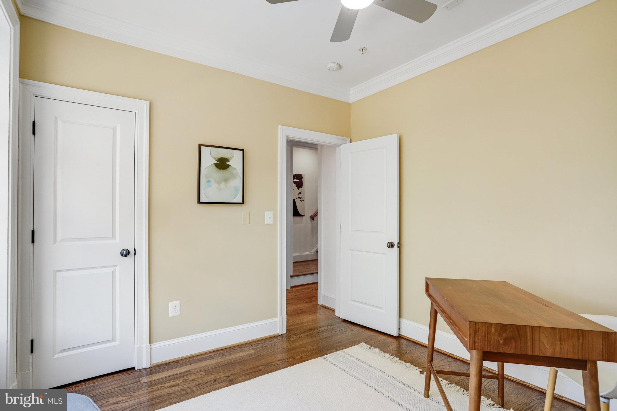 8920 Courts Way Silver Spring, MD 20910 - Photo 19 of 52 a view of a livingroom with wooden floor and a ceiling fan