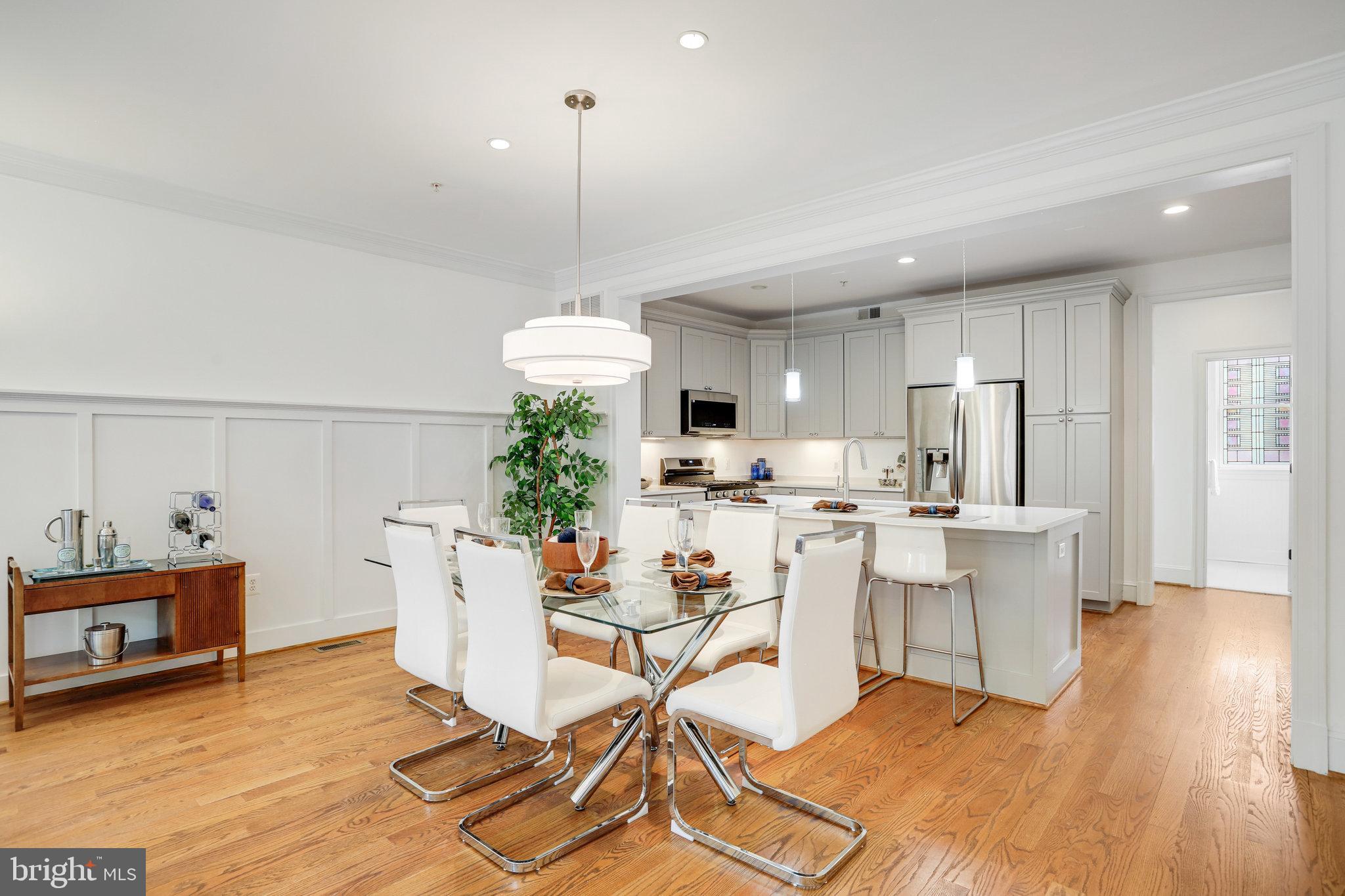 8920 Courts Way Silver Spring, MD 20910 - Photo 2 of 52 a view of a dining room with furniture wooden floor and a chandelier