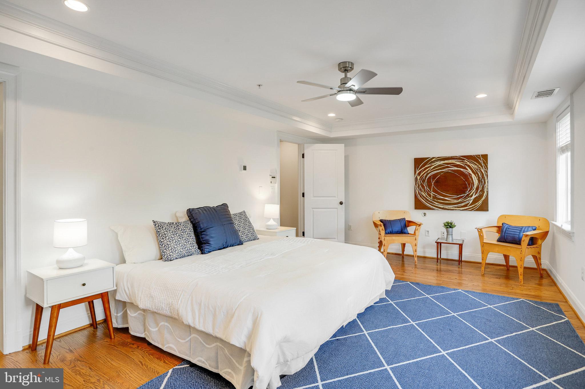 8920 Courts Way Silver Spring, MD 20910 - Photo 23 of 52 a bedroom with a bed a dresser and chair