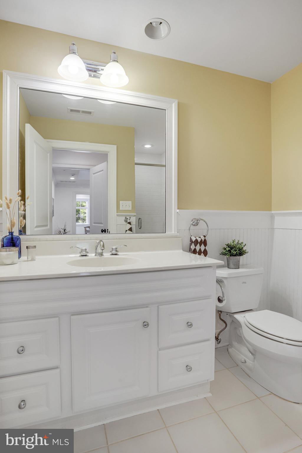 8920 Courts Way Silver Spring, MD 20910 - Photo 32 of 52 a bathroom with a sink a toilet and a mirror