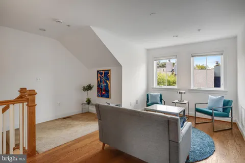 a living room with furniture and a table