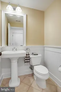 a view of a yard with plants and trees