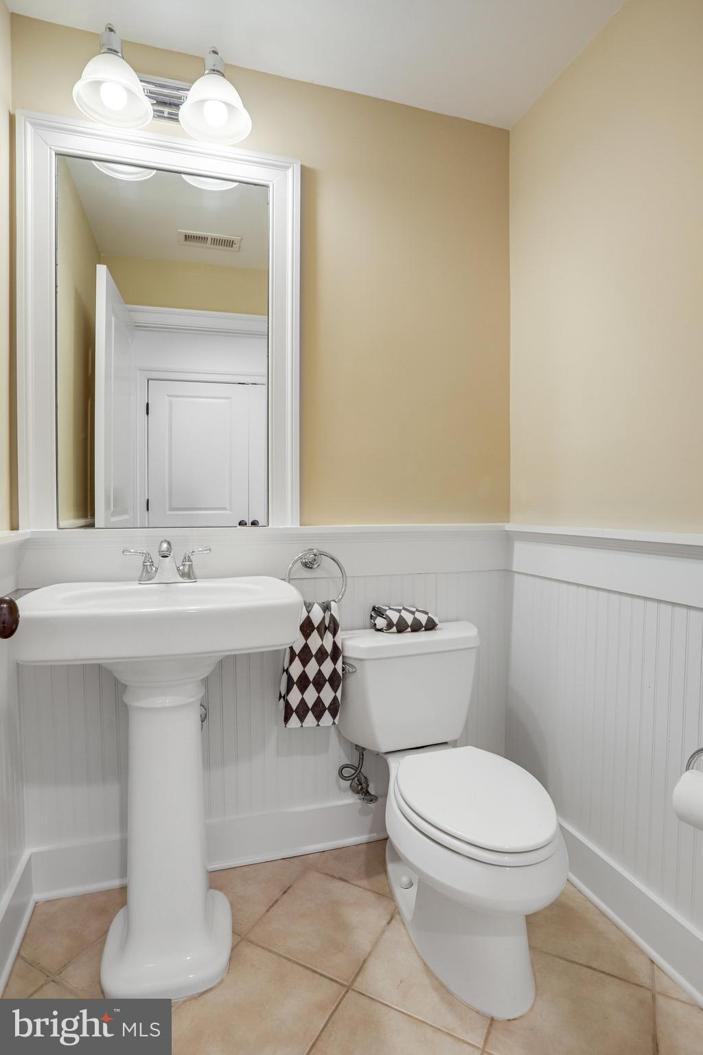 8920 Courts Way Silver Spring, MD 20910 - Photo 43 of 52 a bathroom with a sink a toilet and mirror