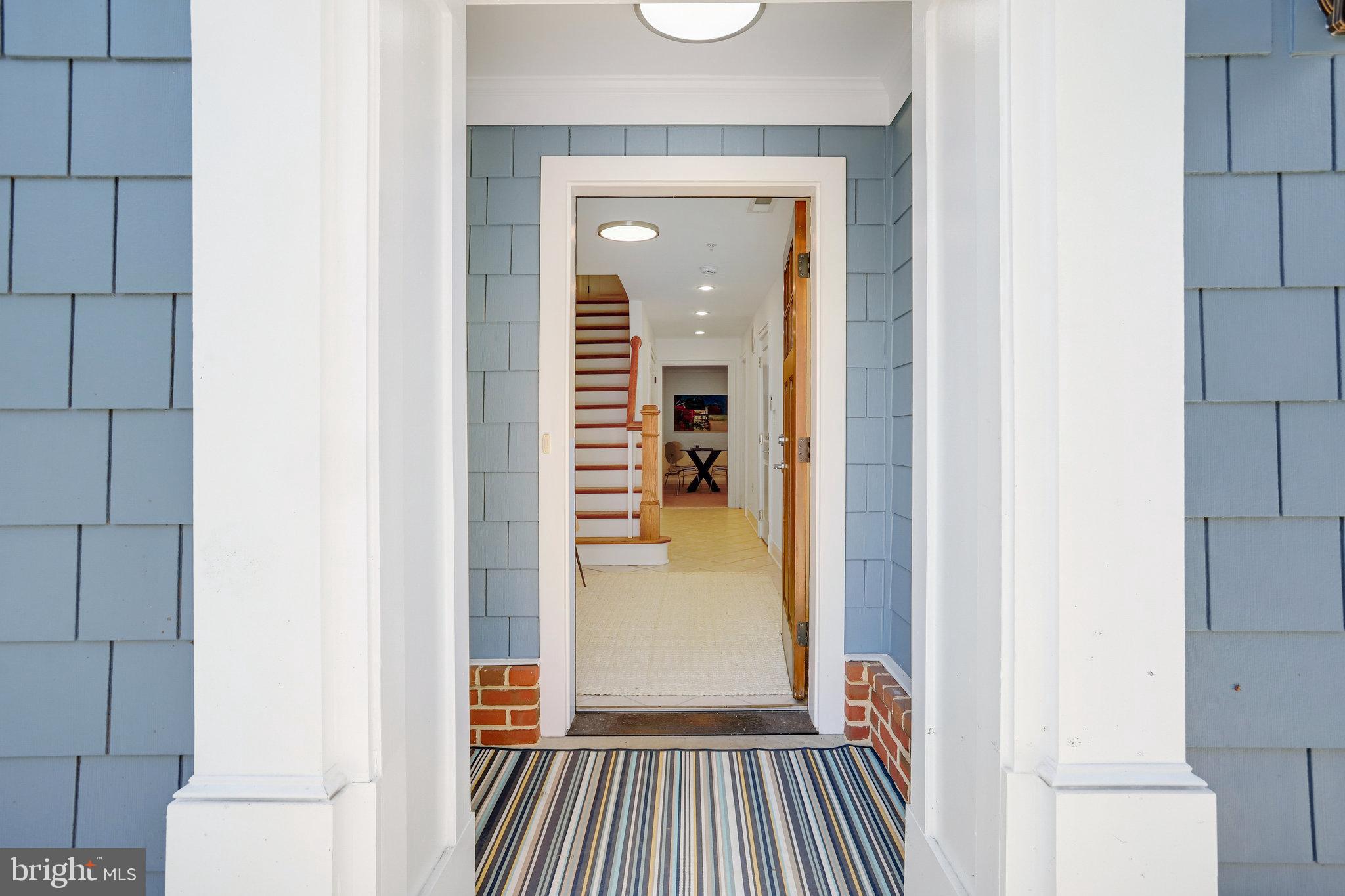 8920 Courts Way Silver Spring, MD 20910 - Photo 5 of 52 a view of a hallway view with wooden floor and staircase