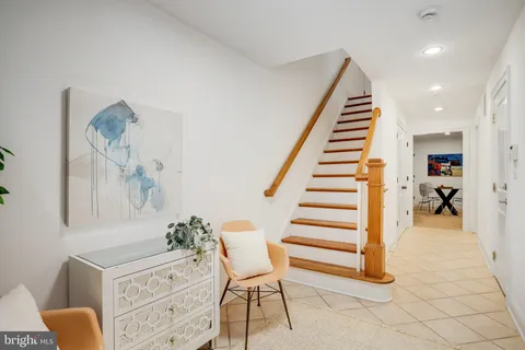 a room with furniture and stairs