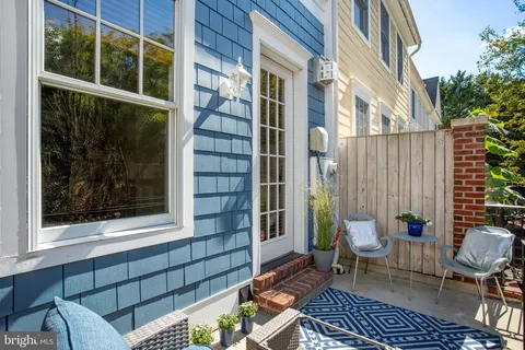 a view of a chair and bench in the porch