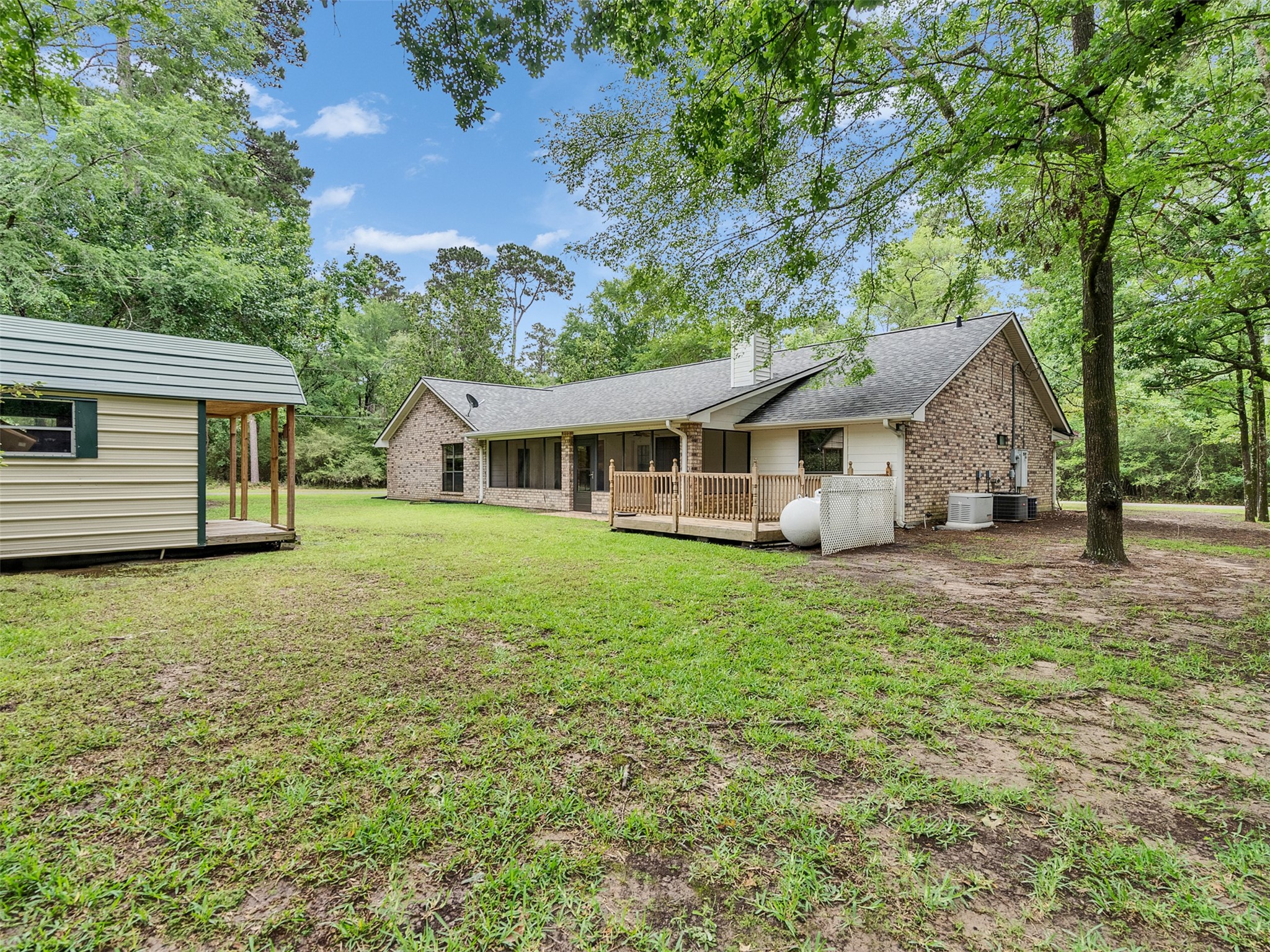 195 Coral Gables Trinity, TX 75862 - Photo 39 of 50 a view of a house with backyard and garden