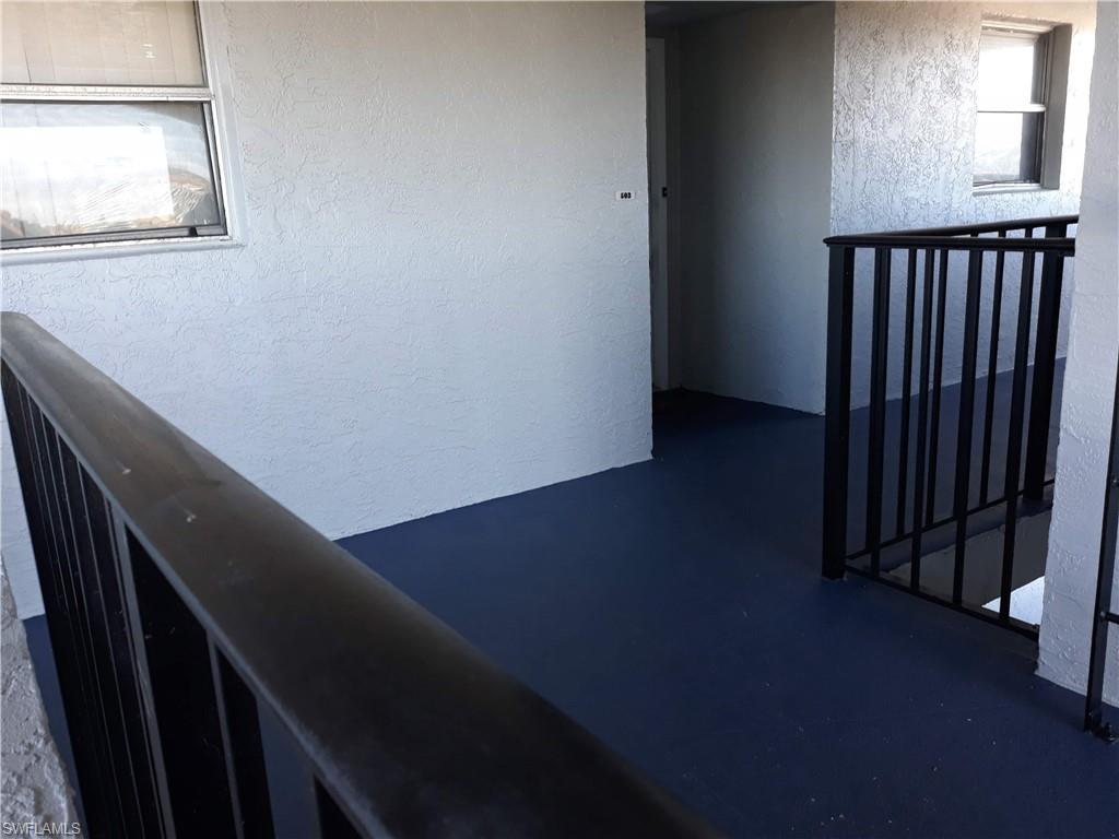 190 Pebble Beach Boulevard, Unit 503 Naples, FL 34113 - Photo 2 of 17 a view of a hallway with wooden floor