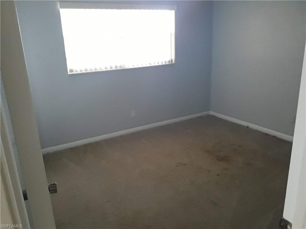 190 Pebble Beach Boulevard, Unit 503 Naples, FL 34113 - Photo 8 of 17 an empty room with a window