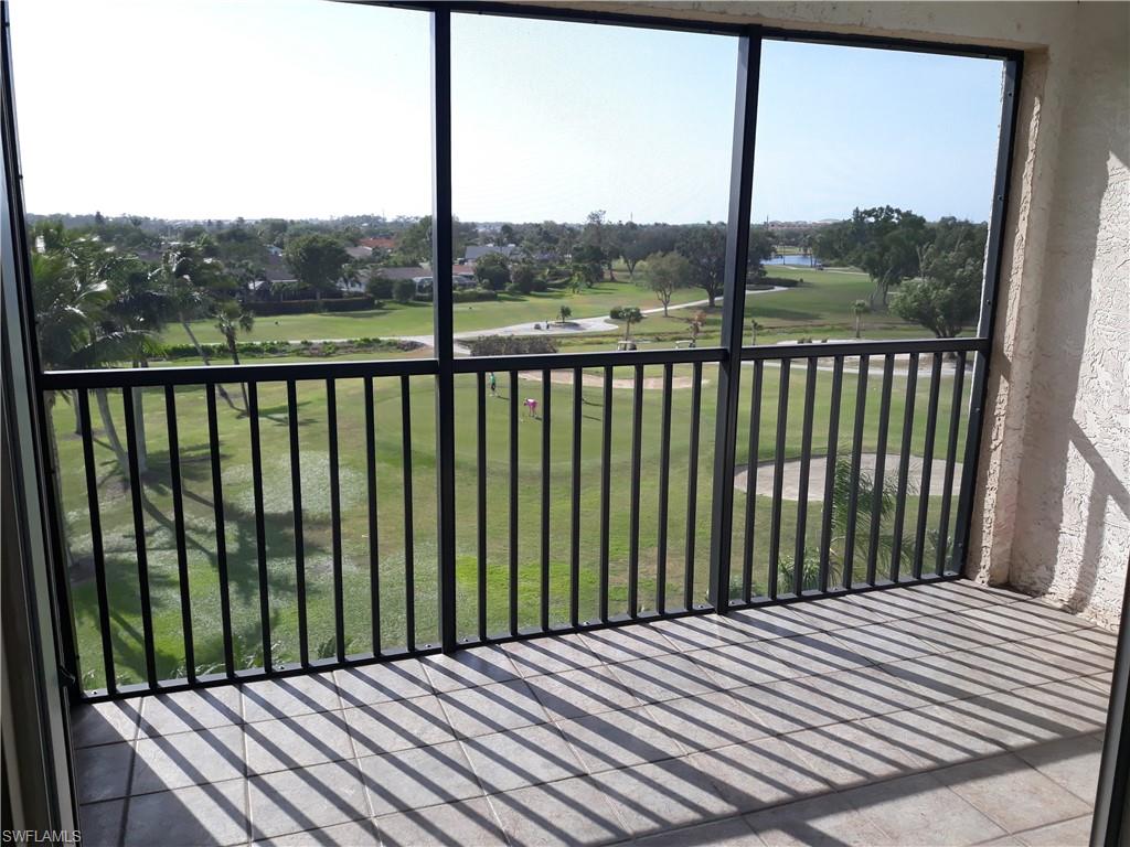 190 Pebble Beach Boulevard, Unit 503 Naples, FL 34113 - Photo 10 of 17 swimming pool view from balcony
