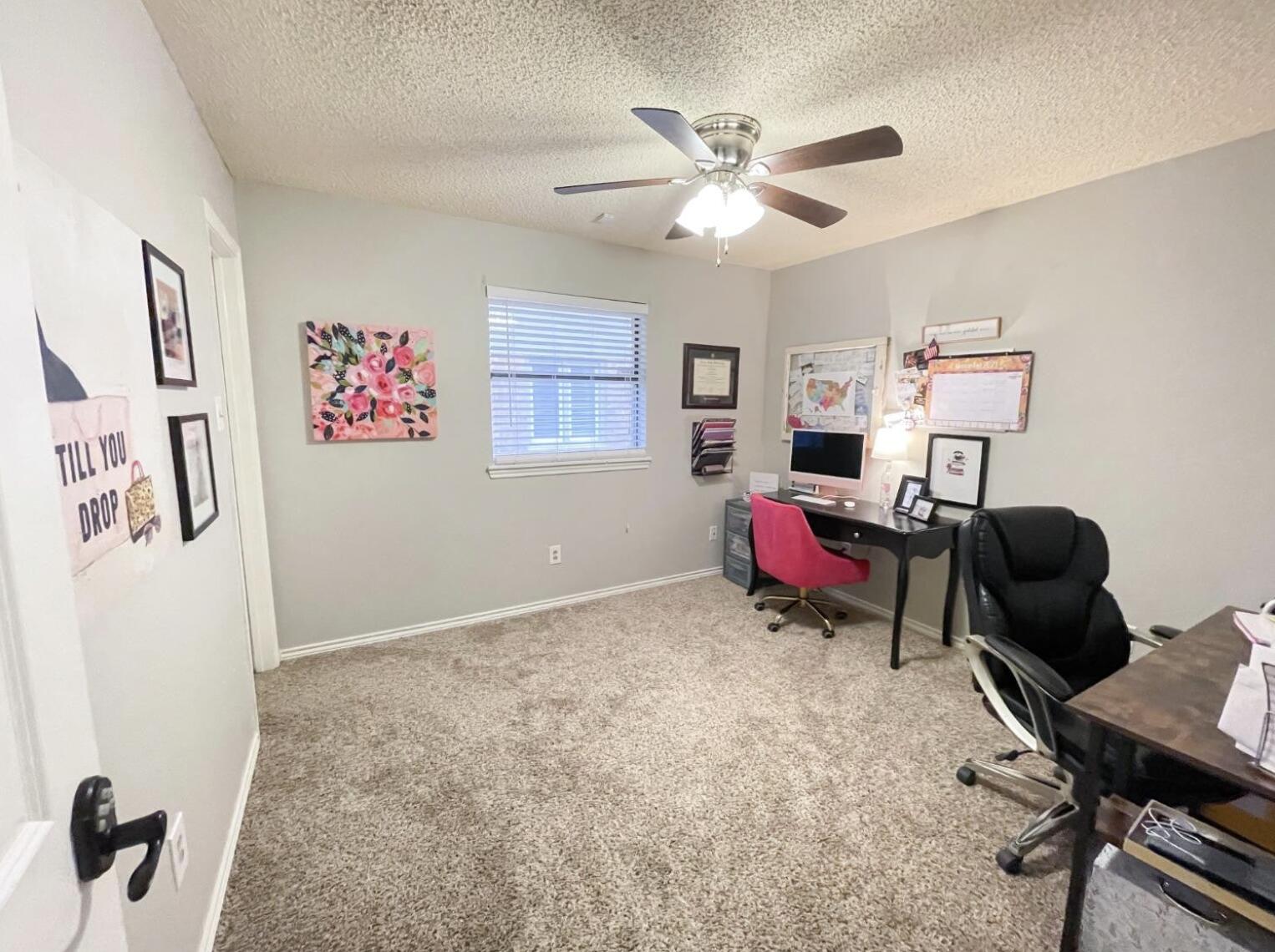 5413 83rd Street Lubbock, TX 79424 - Photo 14 of 21 a living room with furniture and a flat screen tv