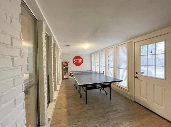 a view of a room with furniture and window