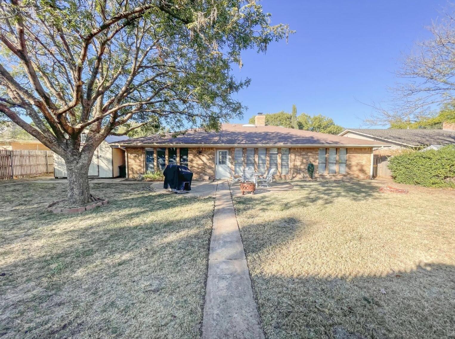 5413 83rd Street Lubbock, TX 79424 - Photo 18 of 21 a view of a yard with a house