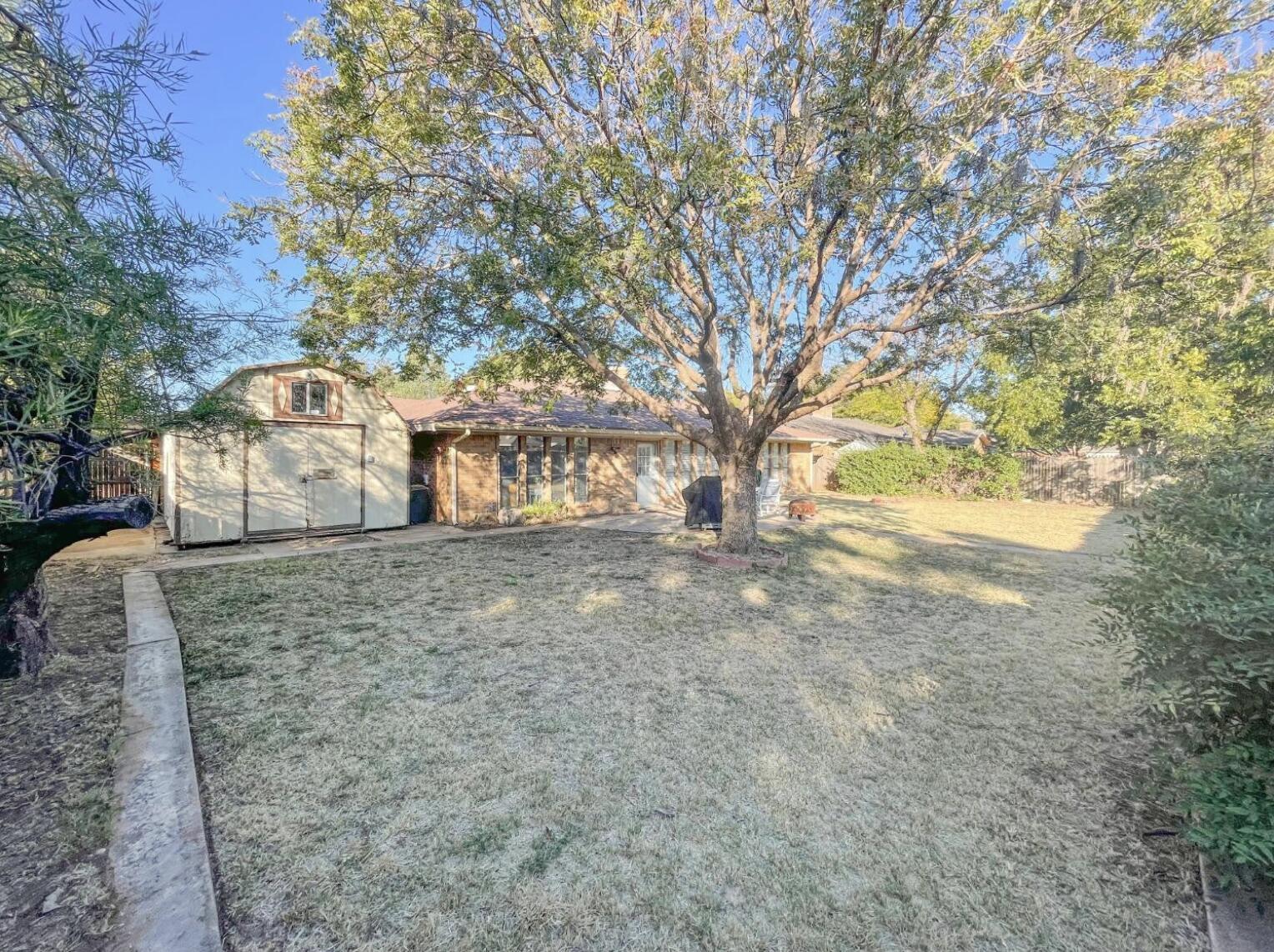 5413 83rd Street Lubbock, TX 79424 - Photo 19 of 21 a view of a house with a yard