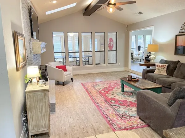 a living room with furniture and a rug