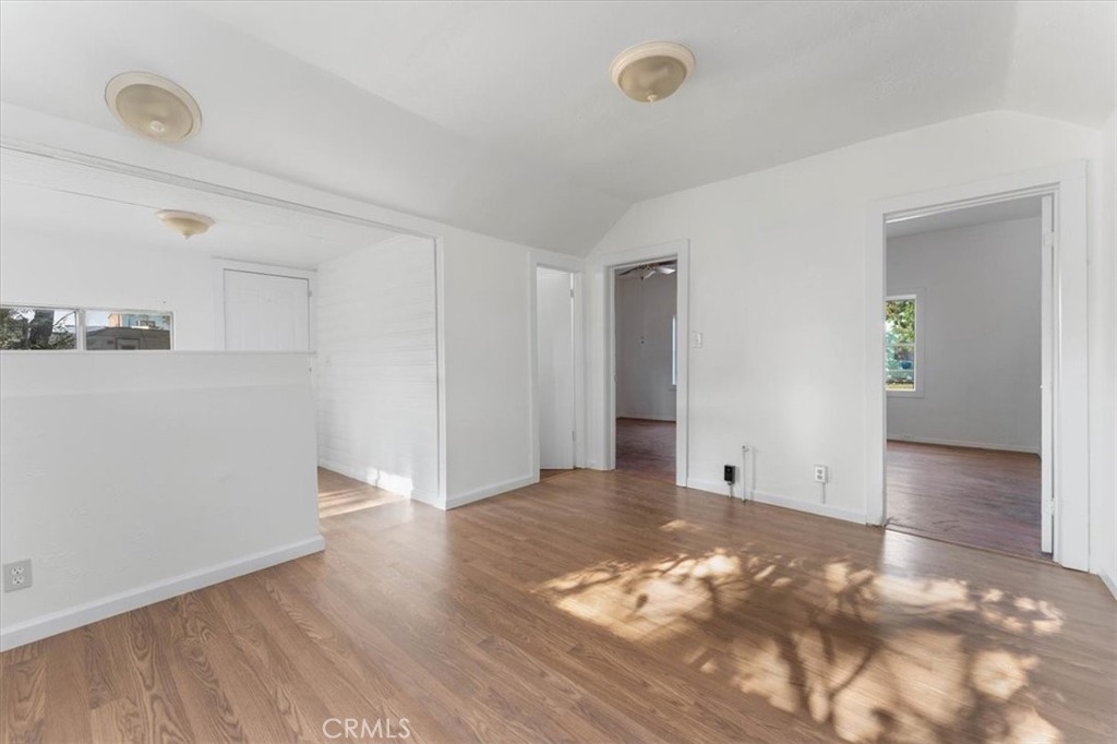 818 6th Street Corning, CA 96021 - Photo 12 of 36 a view of an empty room with wooden floor and closet