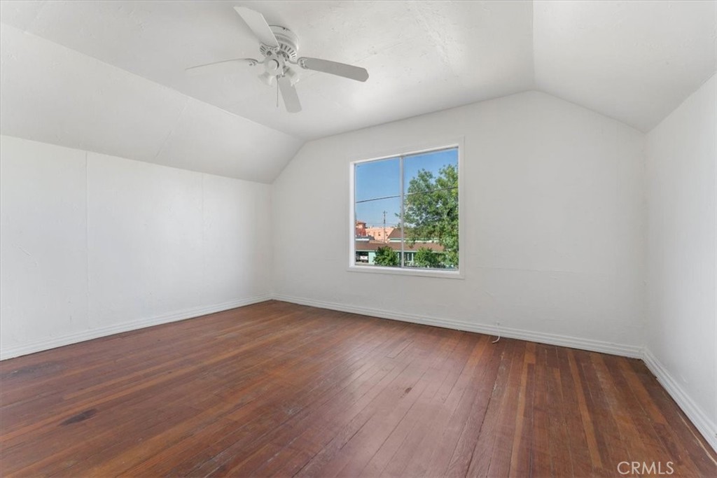 818 6th Street Corning, CA 96021 - Photo 19 of 36 wooden floor in an empty room with a window