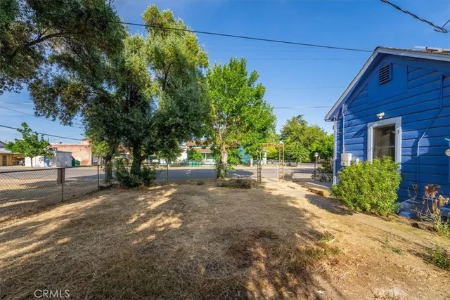 a view of a house with a tree