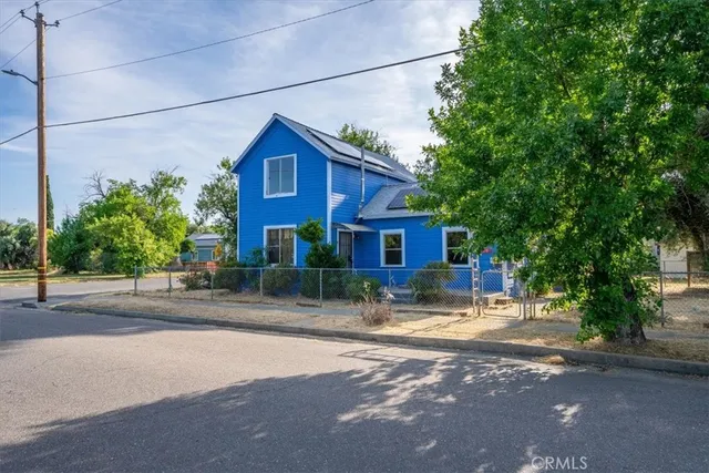 a view of a house with a street