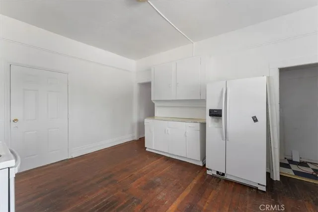 a view of a kitchen with wooden floor