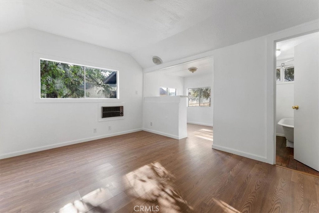 818 6th Street Corning, CA 96021 - Photo 10 of 36 an empty room with wooden floor and windows