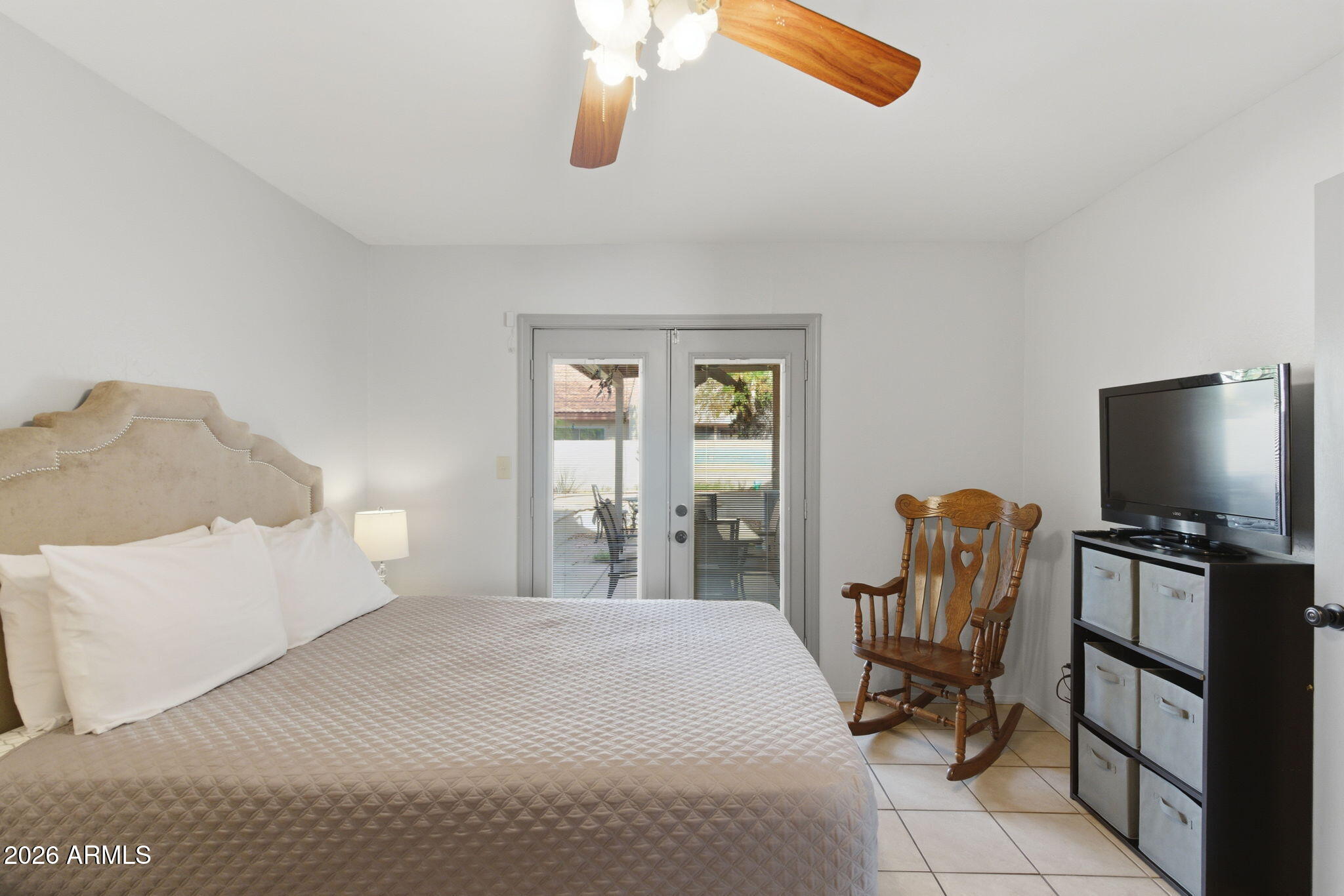 4218 West Boca Raton Road Phoenix, AZ 85053 - Photo 17 of 27 a bedroom with furniture and a flat screen tv