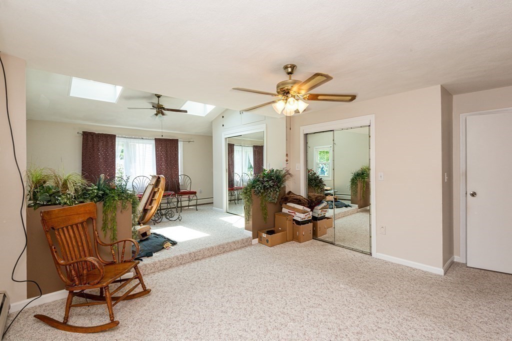 46 Holten Street Peabody, MA 01960 - Photo 17 of 41 a view of a livingroom with furniture and a potted plant