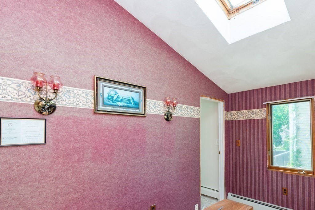 46 Holten Street Peabody, MA 01960 - Photo 20 of 41 a very nice looking room with a large window and a potted plant