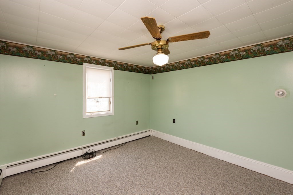 46 Holten Street Peabody, MA 01960 - Photo 22 of 41 a view of a room with window and ceiling fan