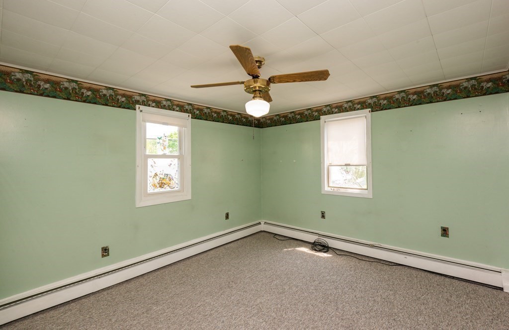 46 Holten Street Peabody, MA 01960 - Photo 23 of 41 a view of room with window and a ceiling fan