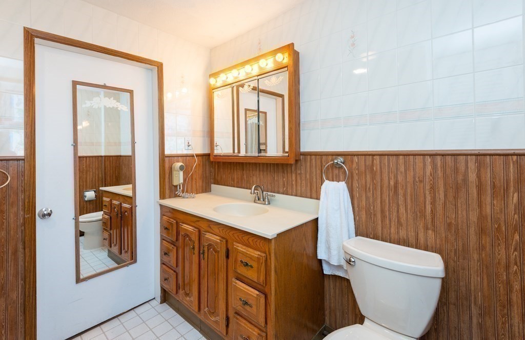 46 Holten Street Peabody, MA 01960 - Photo 24 of 41 a bathroom with a sink a toilet and shower