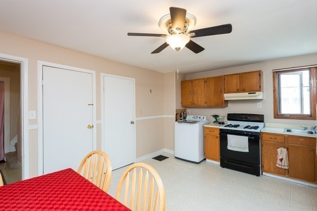 46 Holten Street Peabody, MA 01960 - Photo 30 of 41 a kitchen with stainless steel appliances granite countertop a stove and a refrigerator