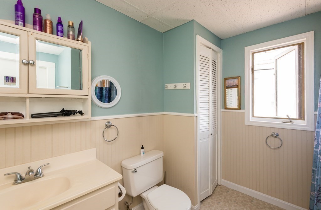46 Holten Street Peabody, MA 01960 - Photo 32 of 41 a bathroom with a sink and a mirror