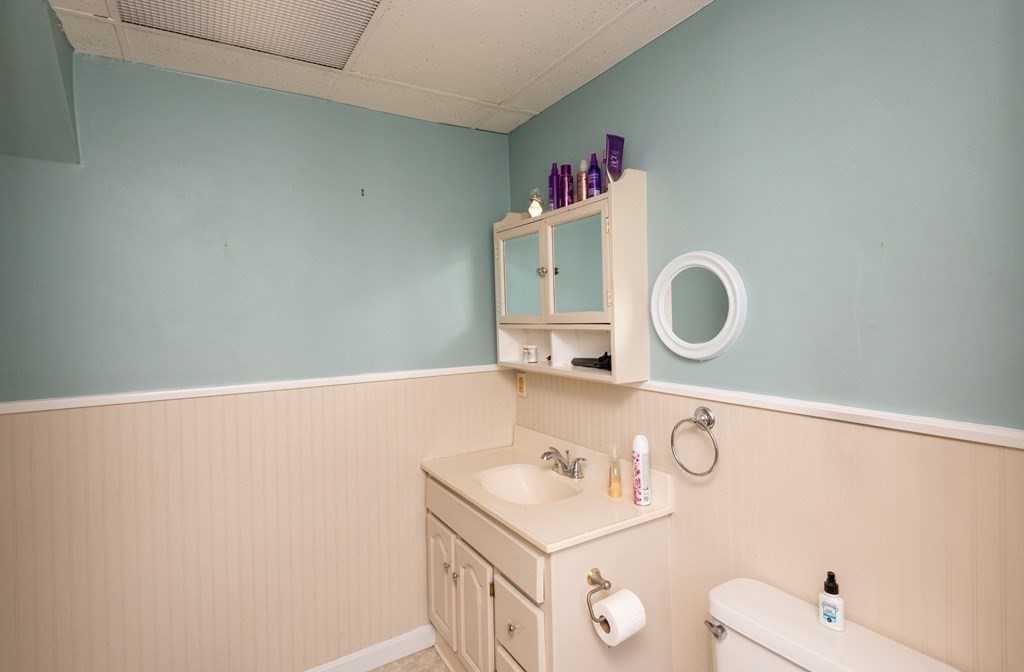 46 Holten Street Peabody, MA 01960 - Photo 33 of 41 a bathroom with a sink and a mirror