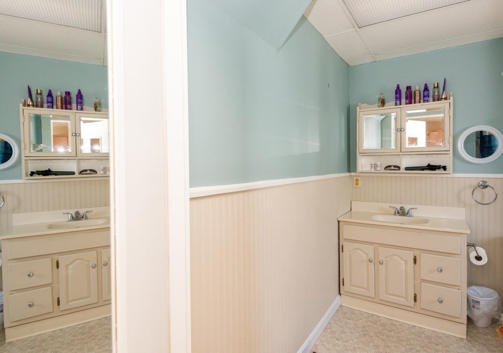 46 Holten Street Peabody, MA 01960 - Photo 34 of 41 a bathroom with a sink a vanity and a mirror