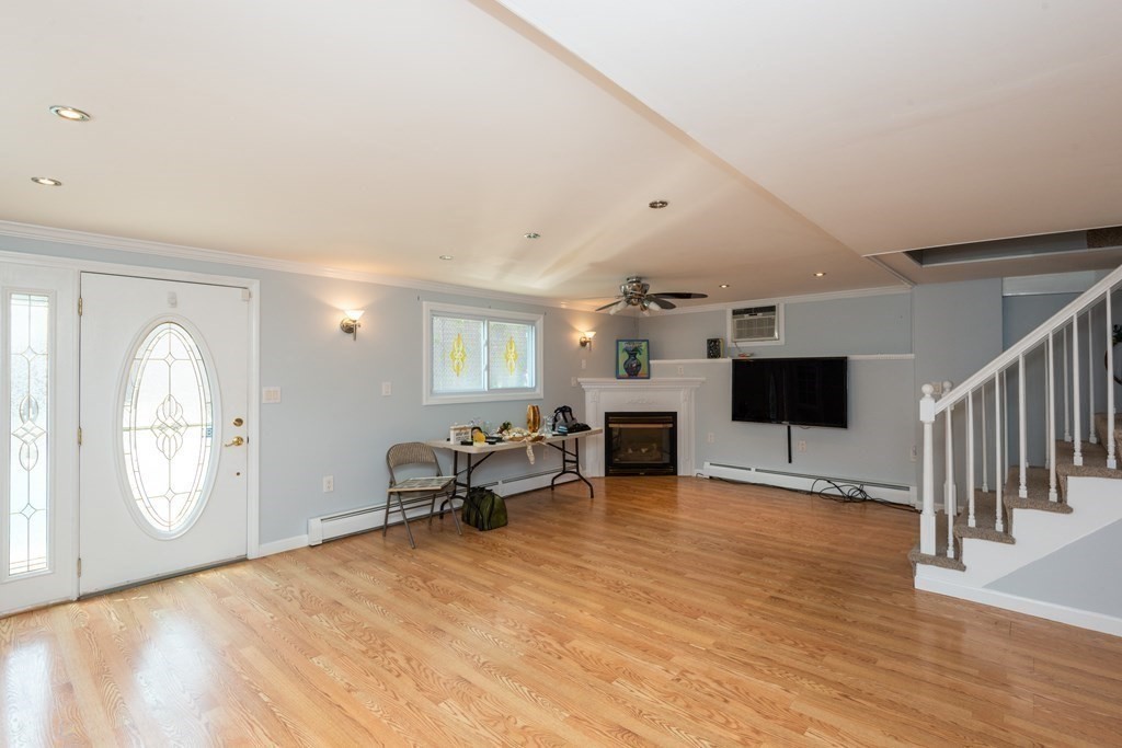 46 Holten Street Peabody, MA 01960 - Photo 6 of 41 a living room with furniture and a flat screen tv
