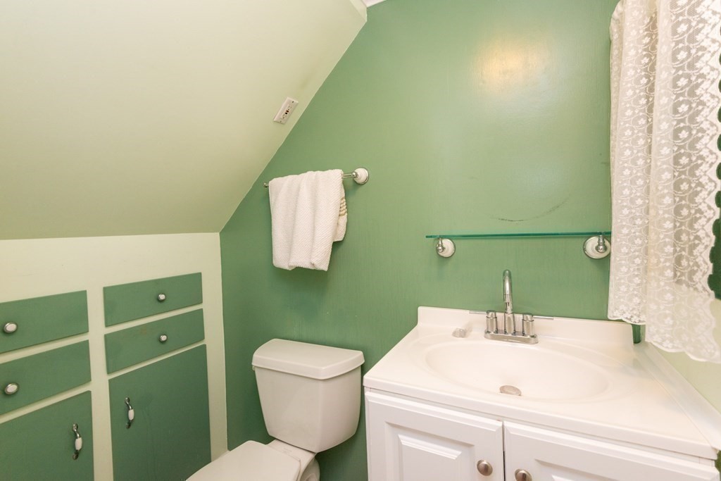 46 Holten Street Peabody, MA 01960 - Photo 10 of 41 a bathroom with a sink and a mirror