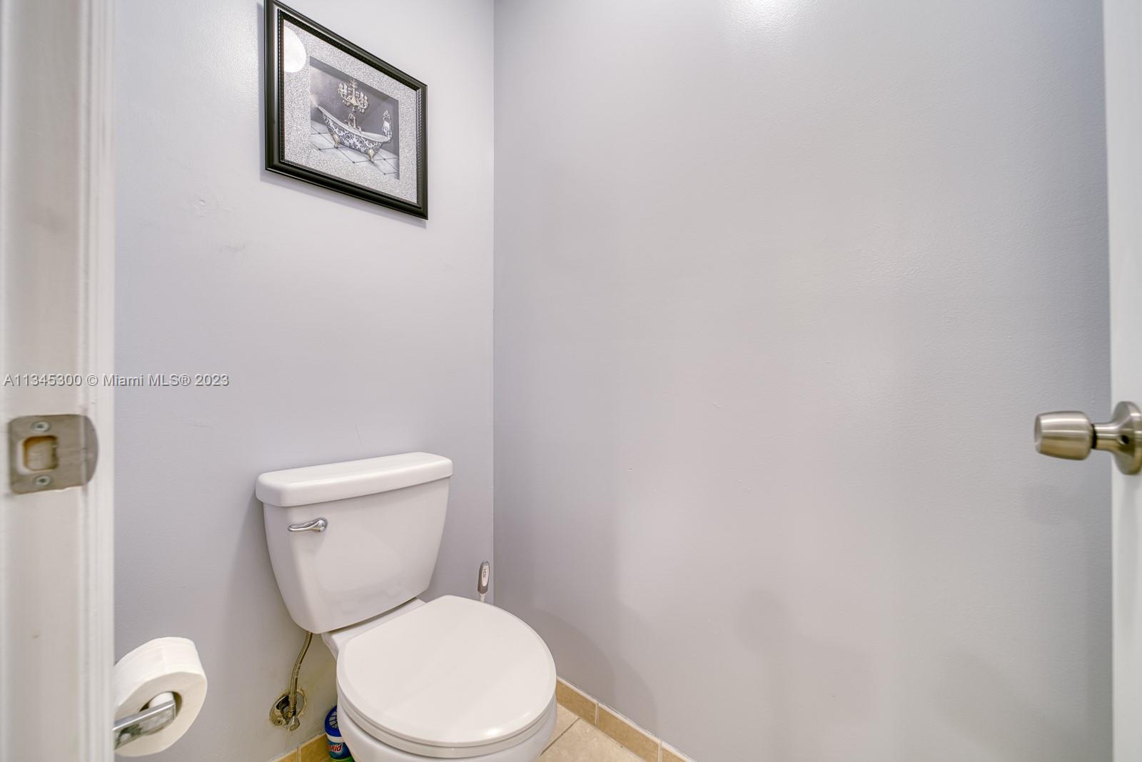 1635 Southeast 20th Place Homestead, FL 33035 - Photo 13 of 28 a white toilet sitting next to a white wall