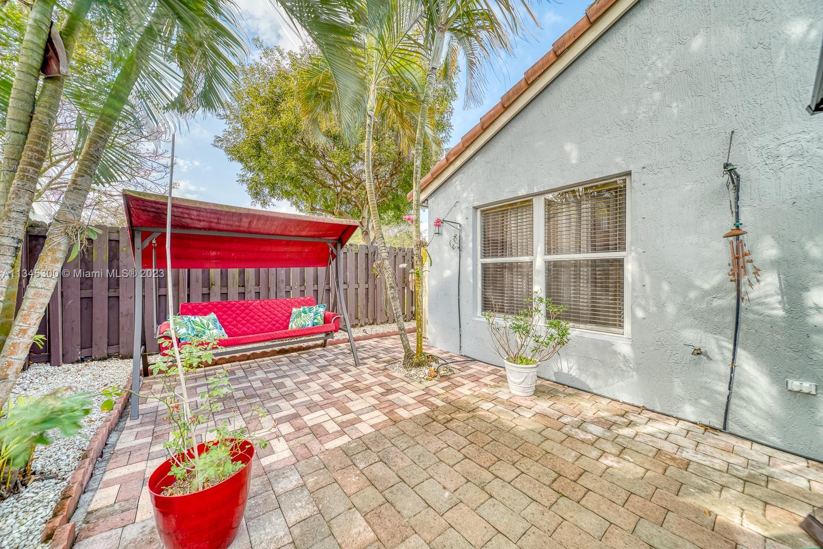 1635 Southeast 20th Place Homestead, FL 33035 - Photo 26 of 28 a view of a backyard with a barn and a yard